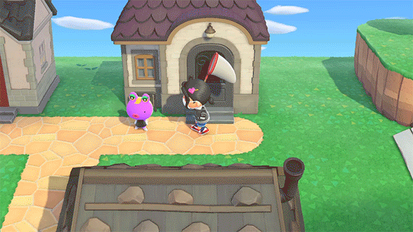 An Animal Crossing character hits a frog with a net, getting a flea off her head.